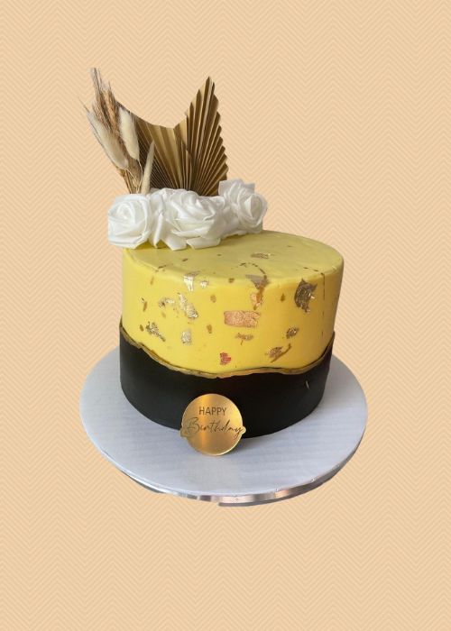 A gold adult cake.