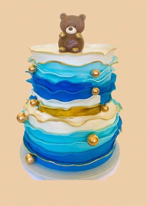 An awesome bear cake for a baby boy.