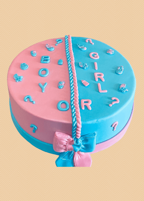A gender reveal cake with pink and blue.
