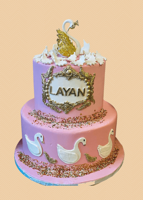 Baby shoer cake with geese and pink.