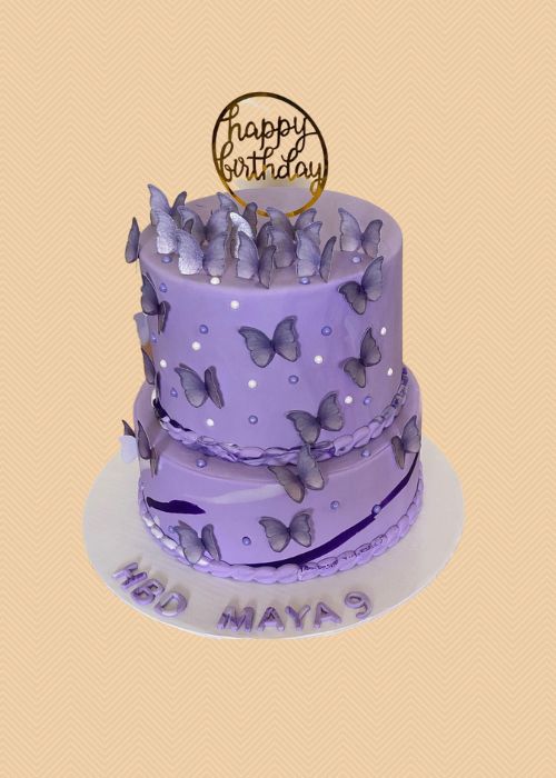 A purple adult birthday cake with butterflies.