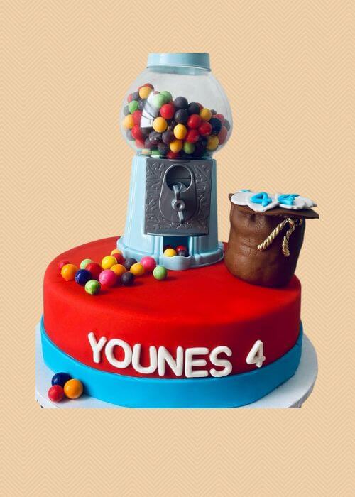 A custom kids cake with gumballs.